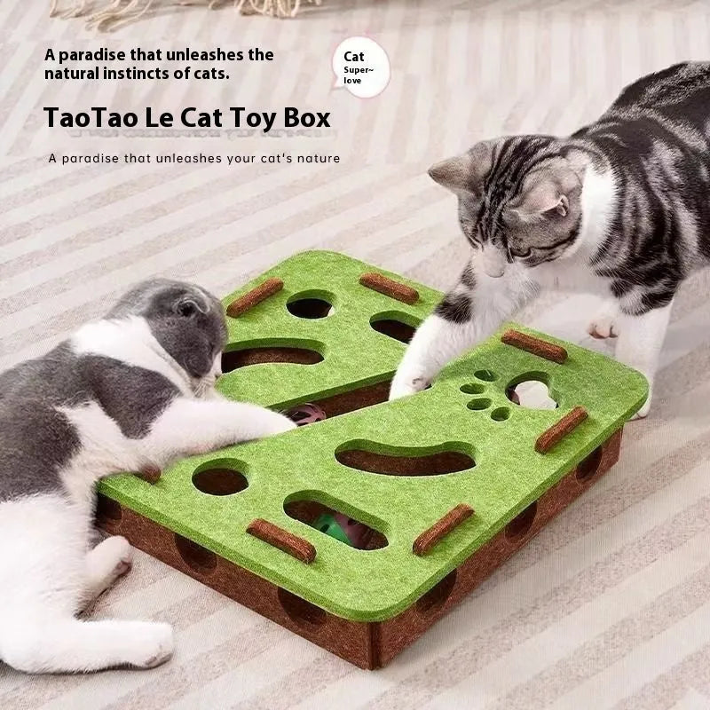 Green brown felt cat toy box with a square hole, measuring 30 cm, on a wooden floor.