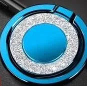 Sparkling bling glitter metal phone holder ring showing rotation, attached to a smartphone.