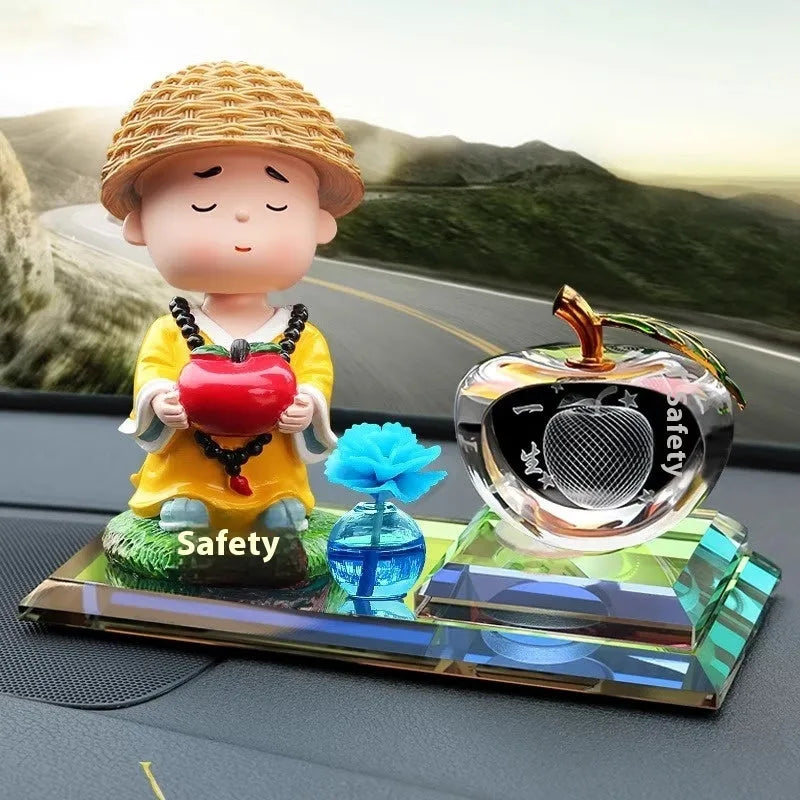 Glass car perfume ornament with crystal carving, cartoon style, in blue or red, including clock, apple, and shaking head monk designs.