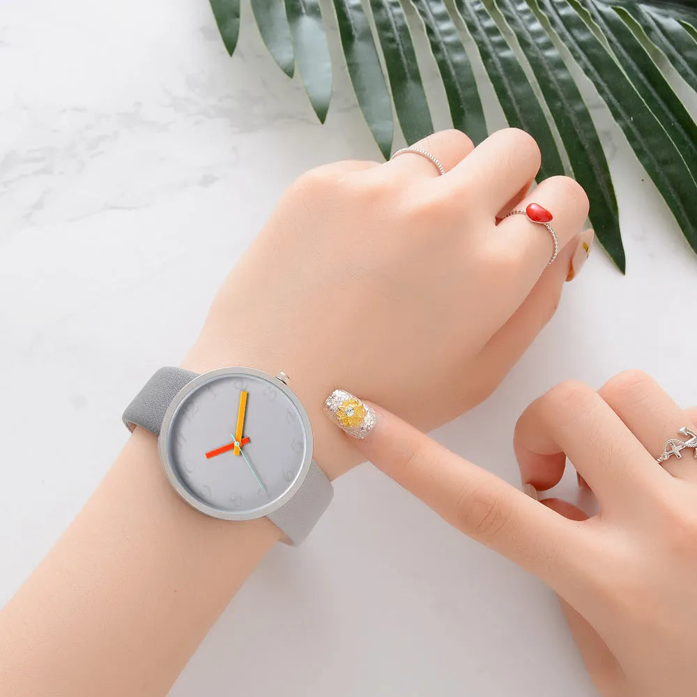 Women's grey contrast PU strap quartz watch with 40mm alloy case, pin buckle, and ordinary glass mirror