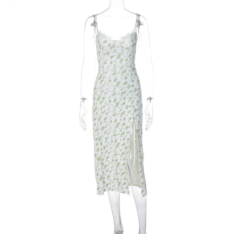 Blue long dress with white lace flower print, featuring a thigh slit and thin suspender straps.