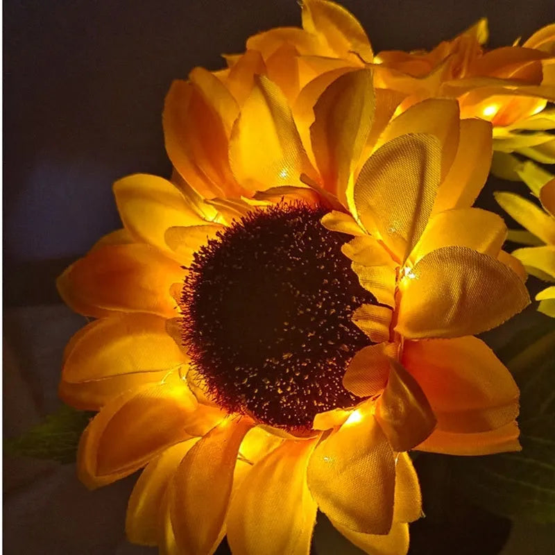 Rechargeable artificial sunflower LED night light on table with USB cable