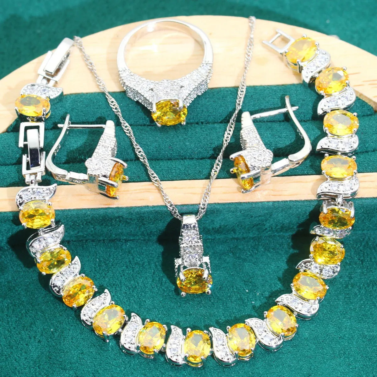 Bridal zircon necklace, bracelet, earrings, and ring four-piece jewellery set in alloy.