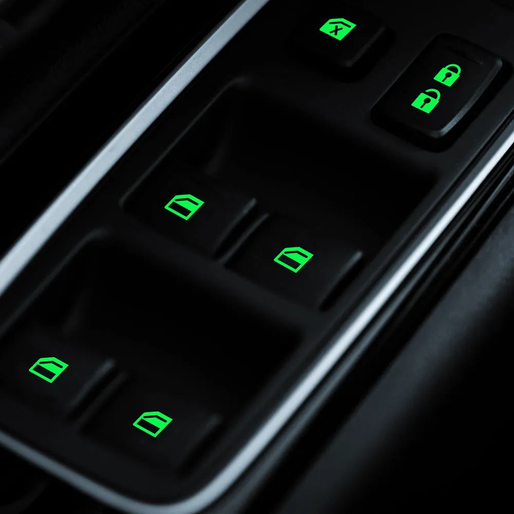 Car window luminous key sticker in blue, green, and orange colours on a window button interior