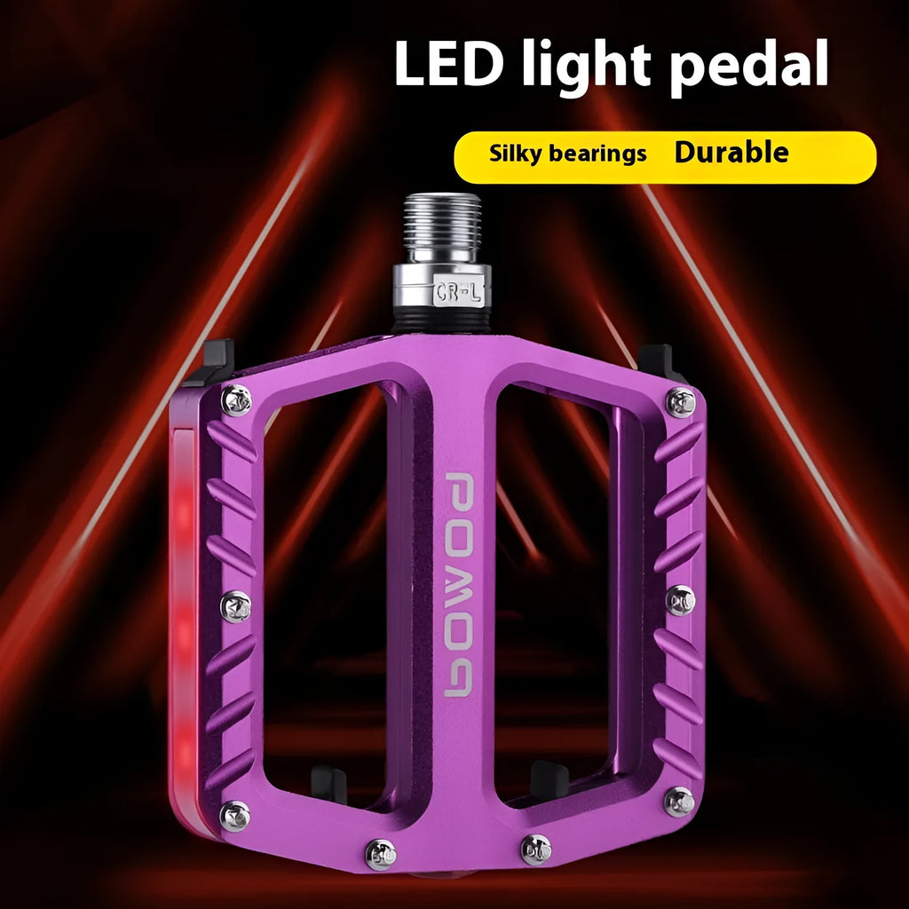 Pair of aluminium alloy bicycle pedals with integrated 710 LED lights in a choice of colours.