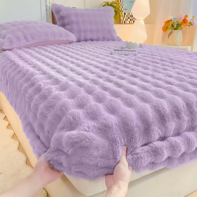 Class A milk fiber fitted sheet with rabbit plush in clear blue, showing elastic edges and smooth surface