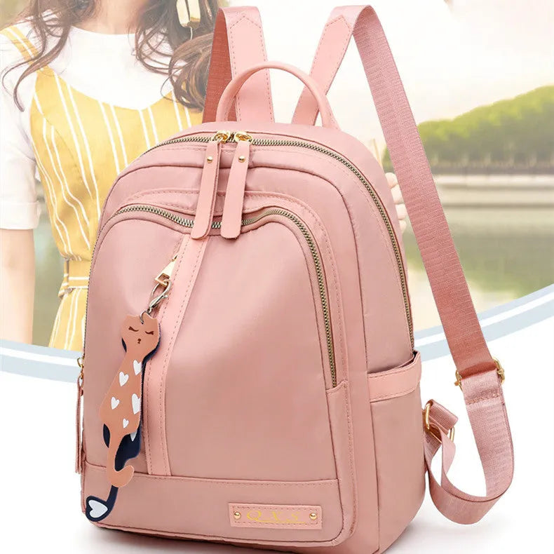 Women's black nylon backpack with anti-theft pockets and water-resistant finish.