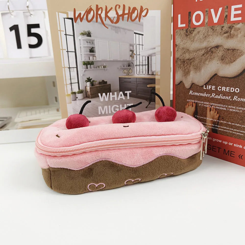 Cherry Cake plush velvet pencil bag with zip closure on a table.