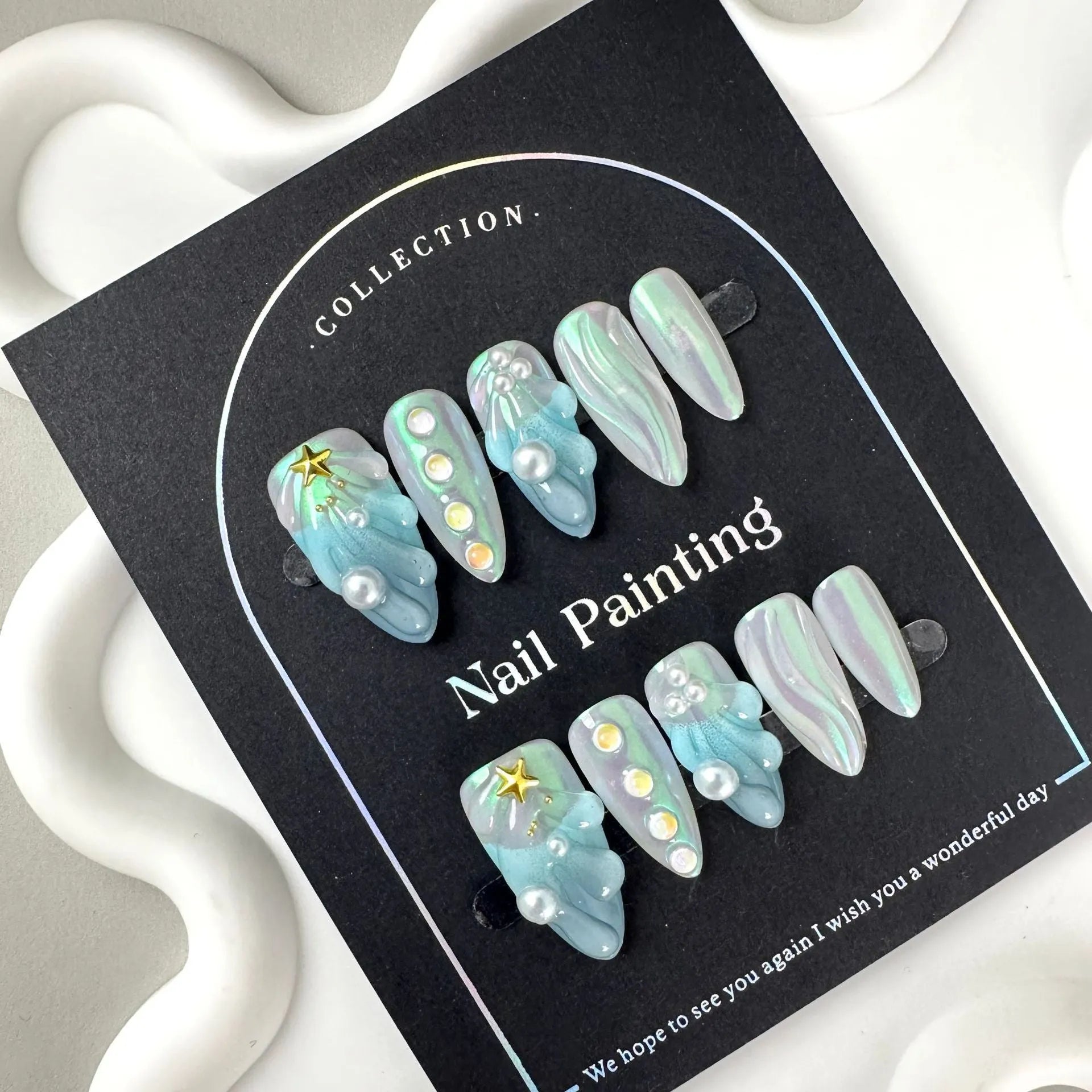 HAILANG blue plastic nail tip guards in four sizes XS, S, M, L for nail protection.