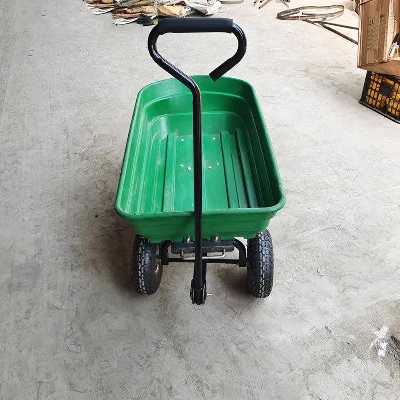 Green four-wheel plastic dump truck with a steel PP body and a tipping load bed.
