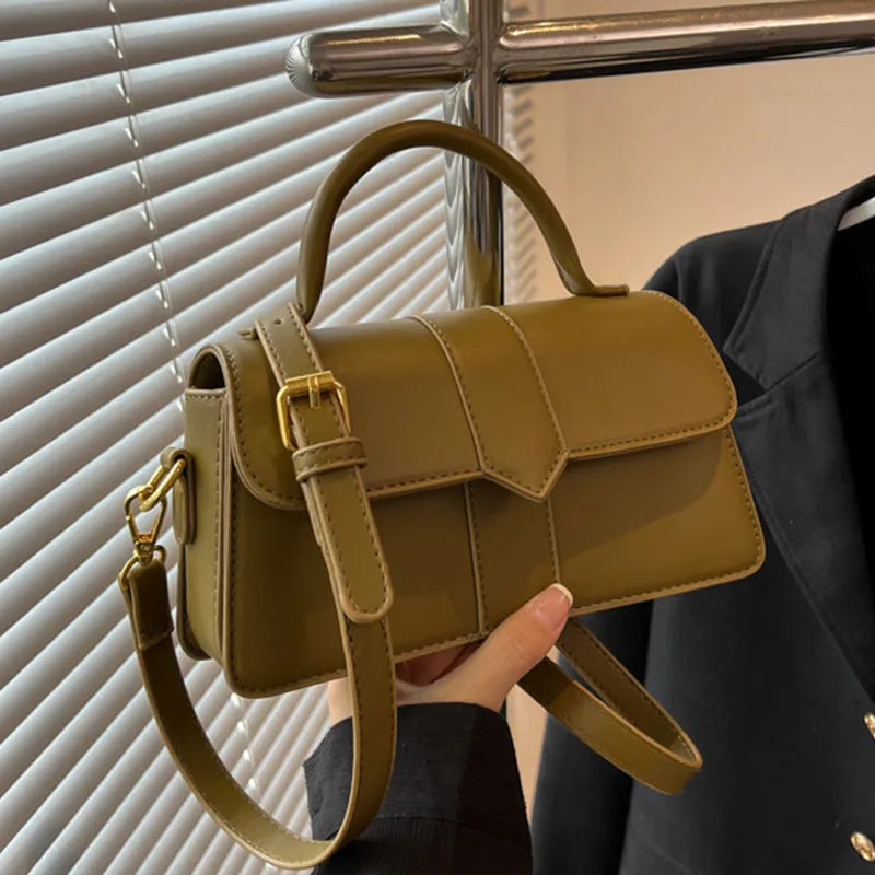 Women's beige messenger bag showing file compartment and sandwich pocket exterior