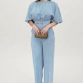 Blue men's polyester suit set with long-sleeved jacket and trousers on a hanger.