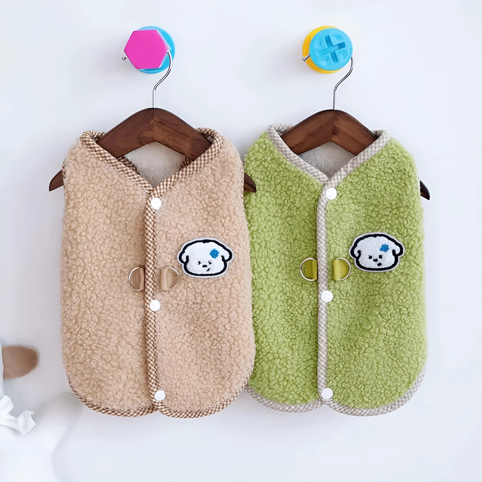 Green coral fleece dog vest with a leash ring on a small dog.