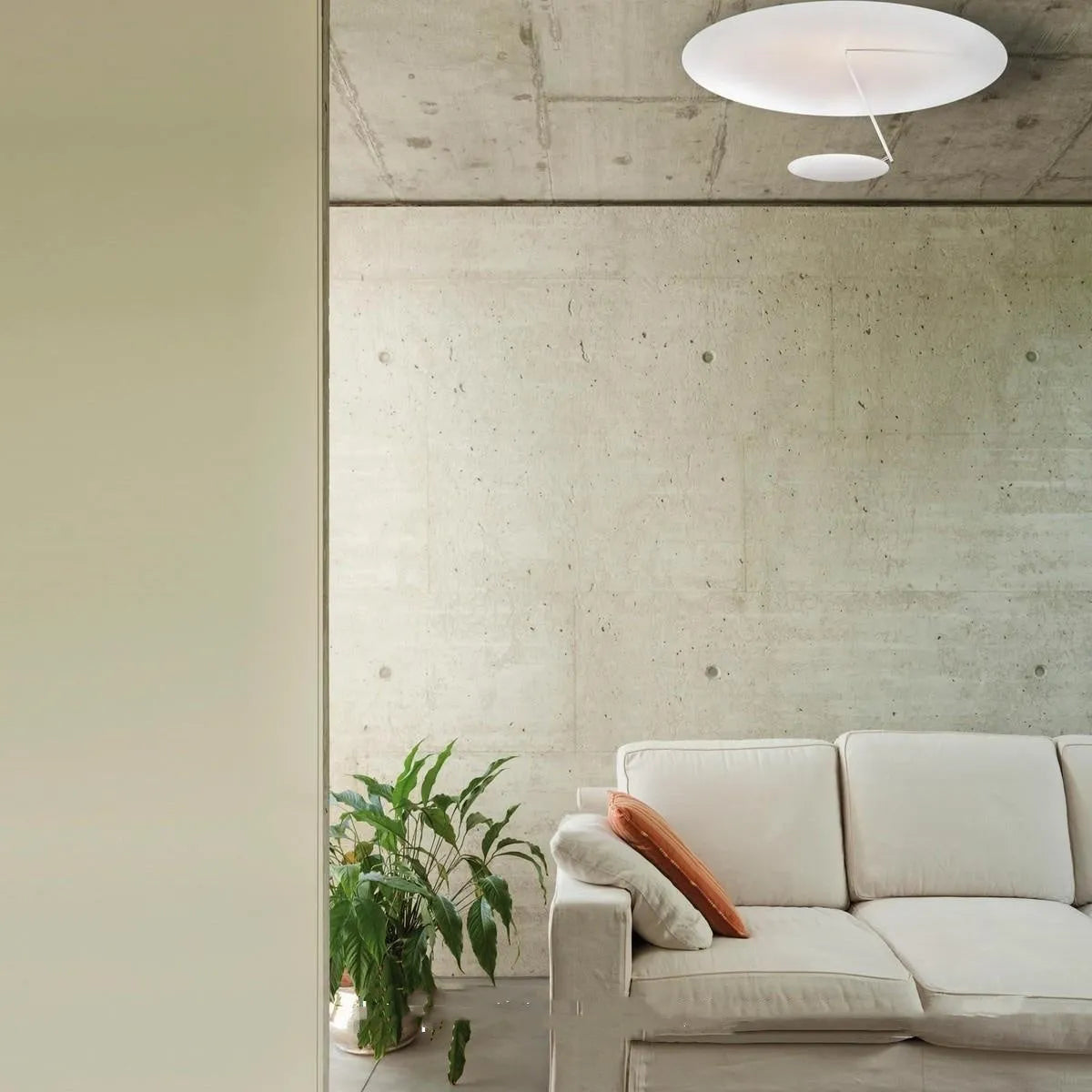 Modern circular iron ceiling lamp with a white powder-coated shade and integrated warm white LED light