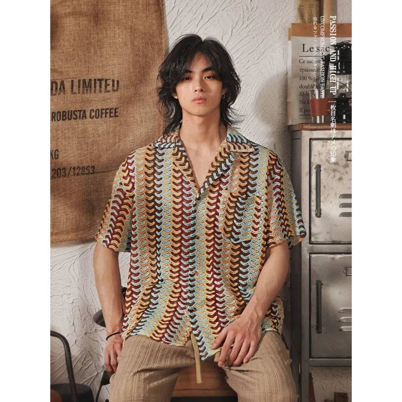 Grey short sleeve Cuban collar shirt with jacquard pattern, shown on a model.