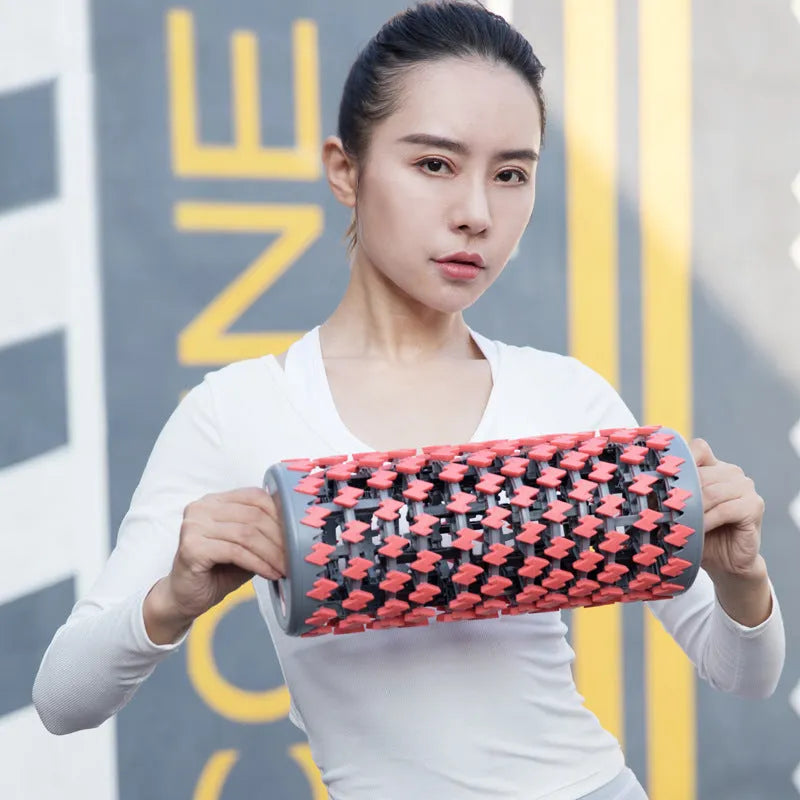 Adjustable telescopic foam roller in red, black, pink, and yellow colour options for muscle recovery.