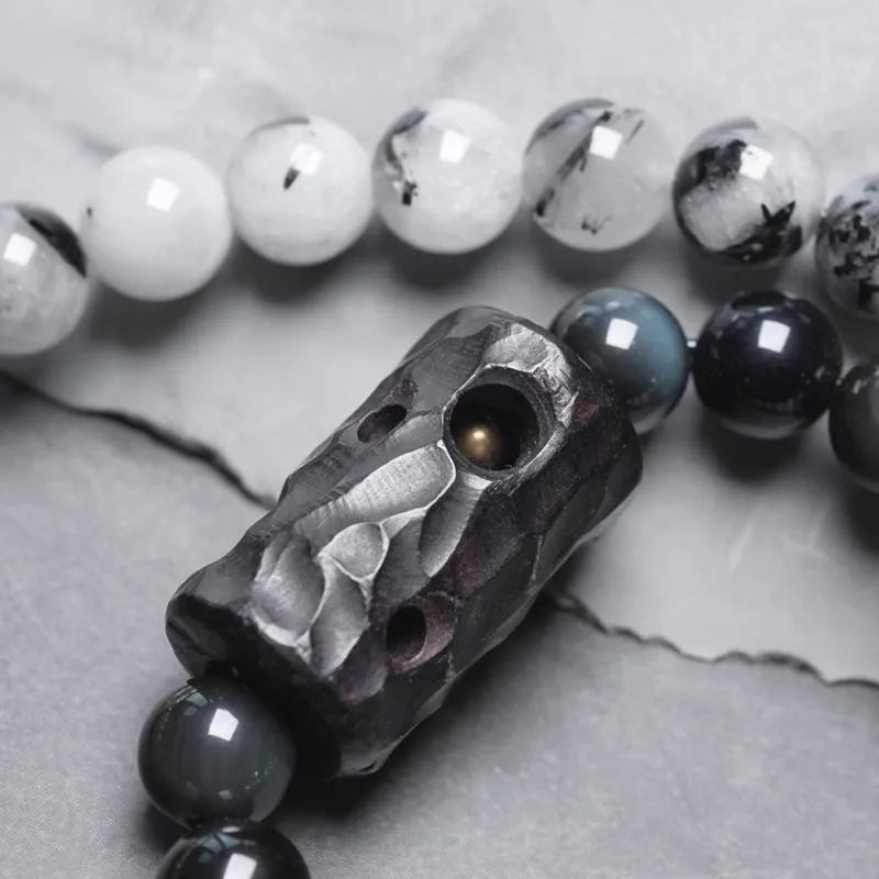 Ethnic black hair bracelet with white crystal tassel, shown in boys and girls size options.