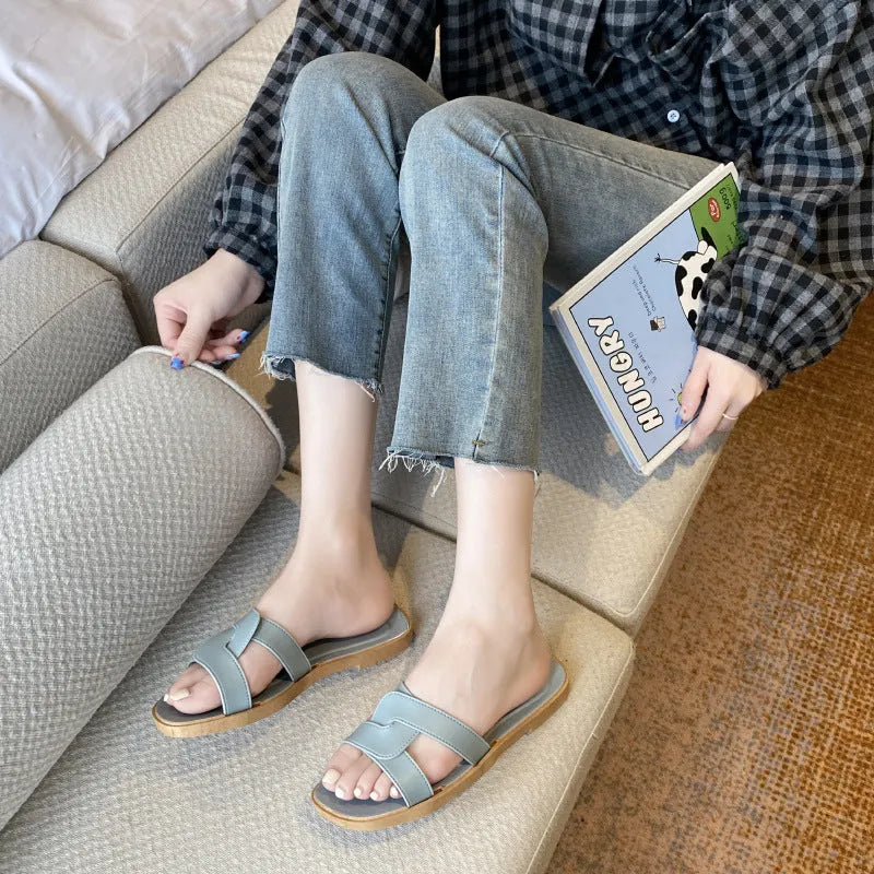 Women's PVC cross strap sandals in light blue colour showing non-slip sole and toe ring design