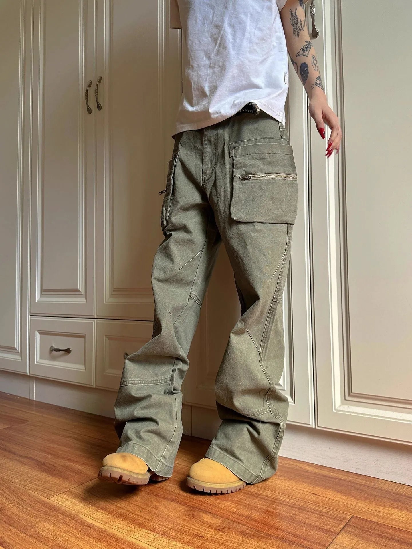 Green double zipper cotton workwear casual pants with a pocket, shown in mid-waist overalls style.