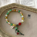M990 Lotus Ruyi bracelet showing mixed material construction and lotus motif with manual craft details