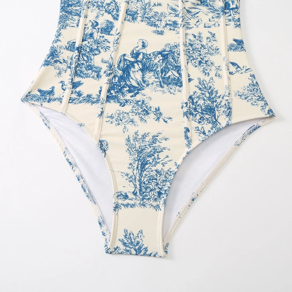 Blue patterned women's one-piece swimsuit with matching gauze skirt shown in multiple size options
