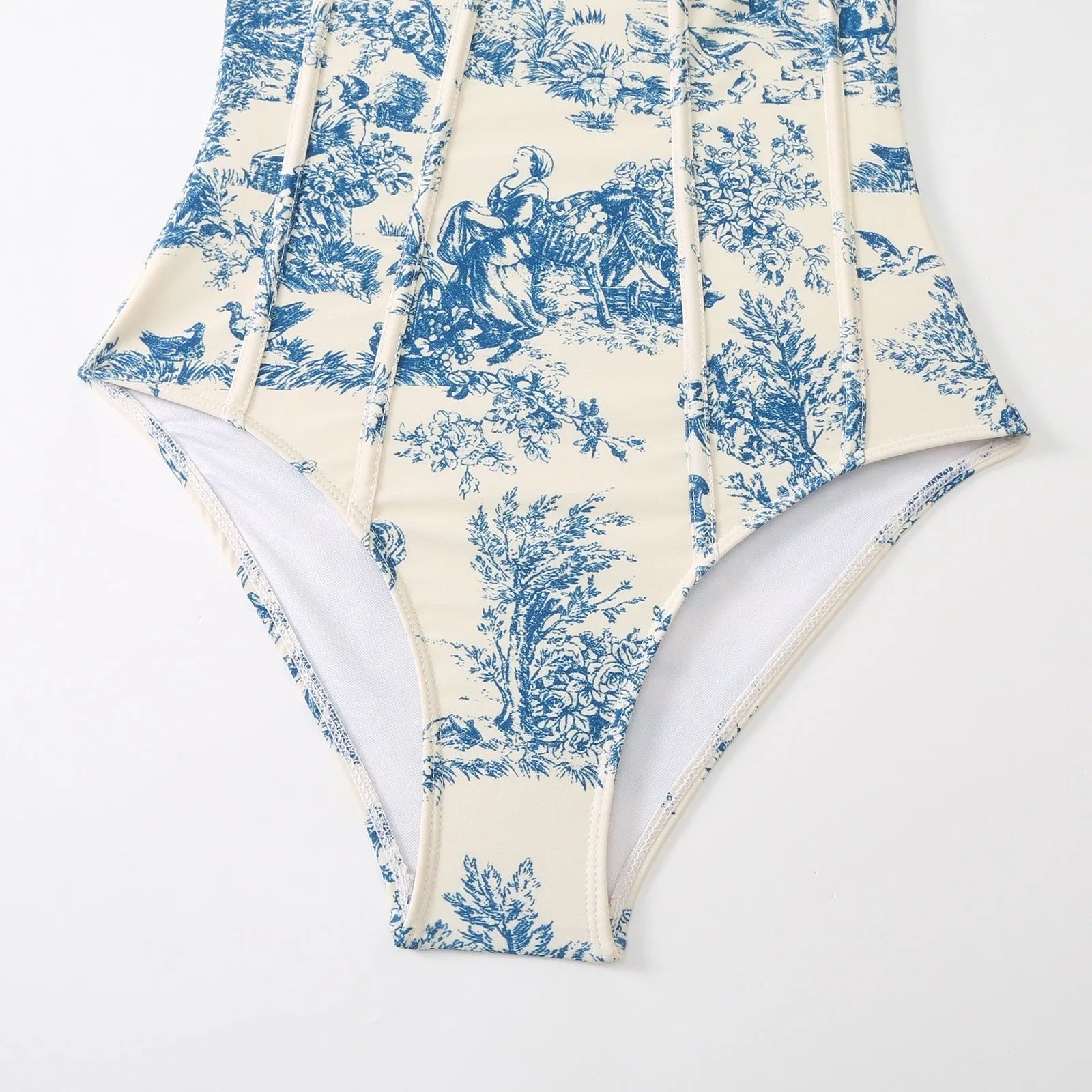 Blue patterned women's one-piece swimsuit with matching gauze skirt shown in multiple size options