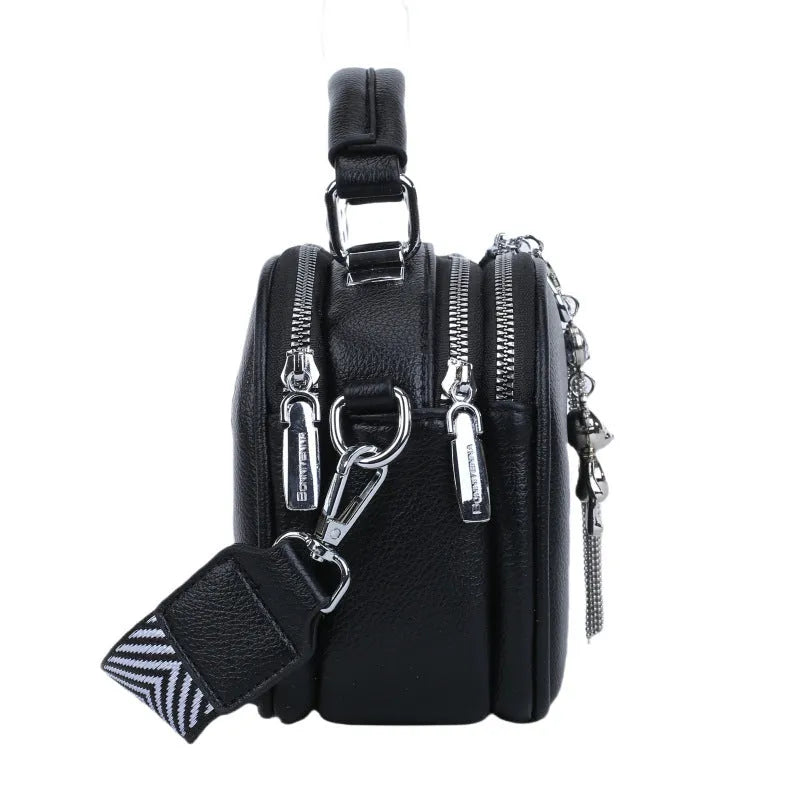 Oval-shaped women's small square handbag in PU with stitching detail and double straps.