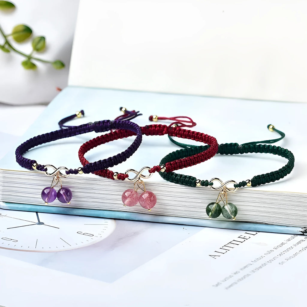 Women's Natural Strawberry Quartz bracelet with a fruit-shaped crystal bead on an elastic cord.