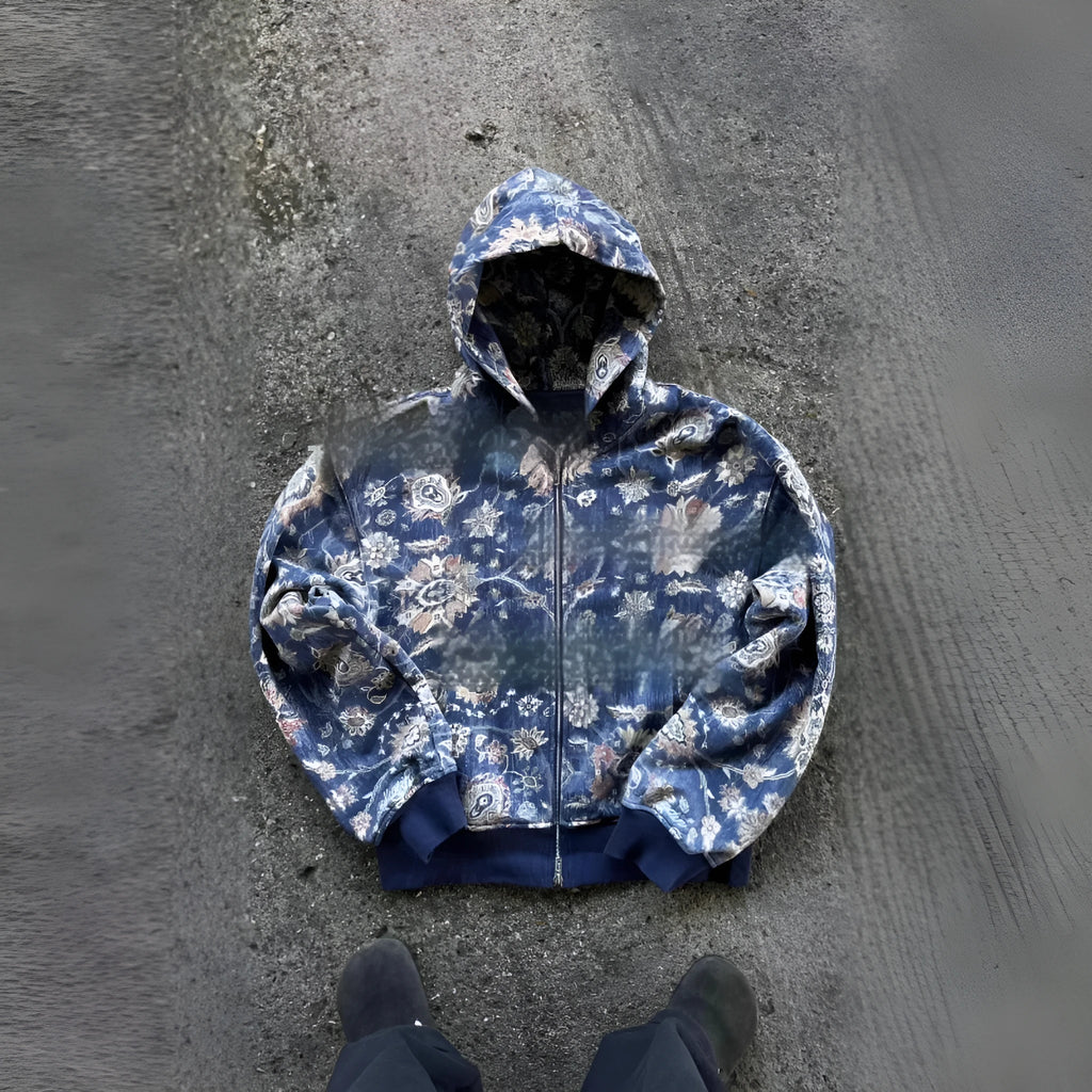 Man wearing a loose-fitting blue hooded zip coat with long sleeves for casual autumn wear.