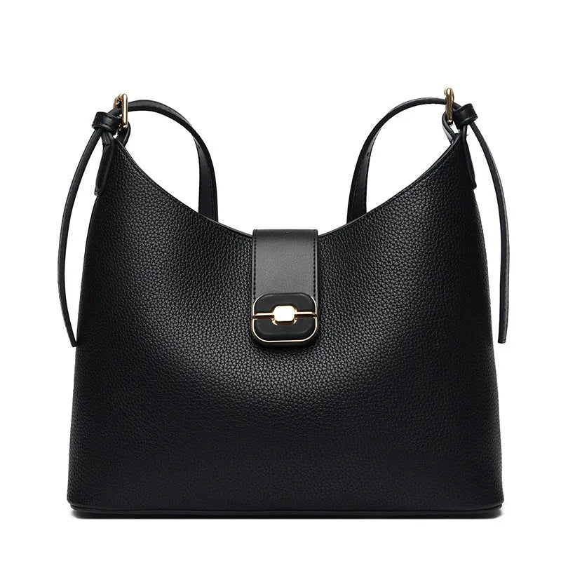 PU bucket bag in beige with contrast stitching, single shoulder strap, and open top showing internal organiser pockets.