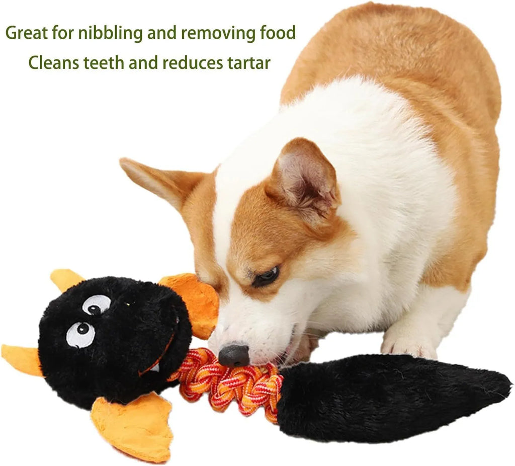 Large black plush dog toy with cartoon design, featuring a squeaker, rattle, and an elastic rope knot for chewing.