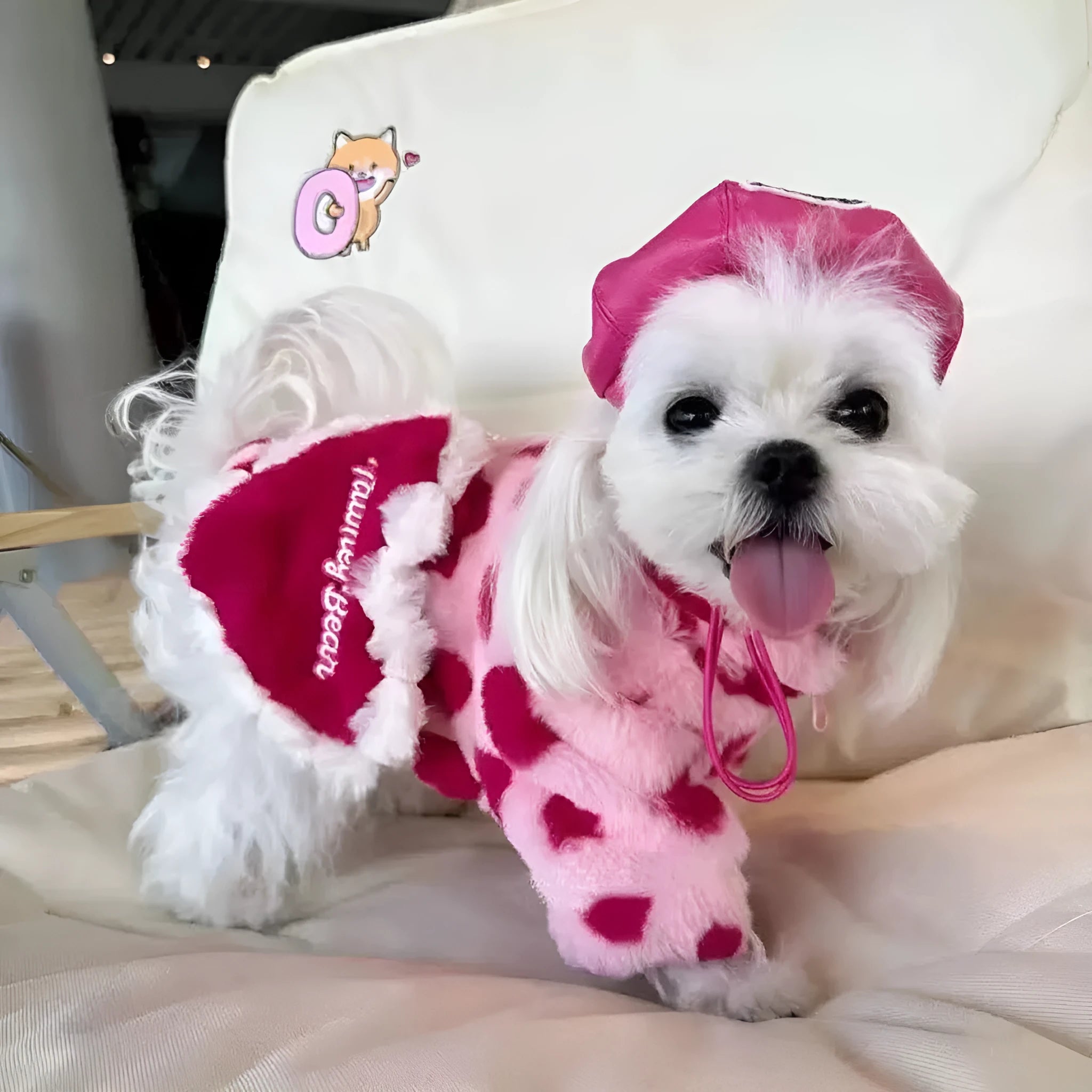 Pink polyester plush warm coat for small dog on white background showing British styling