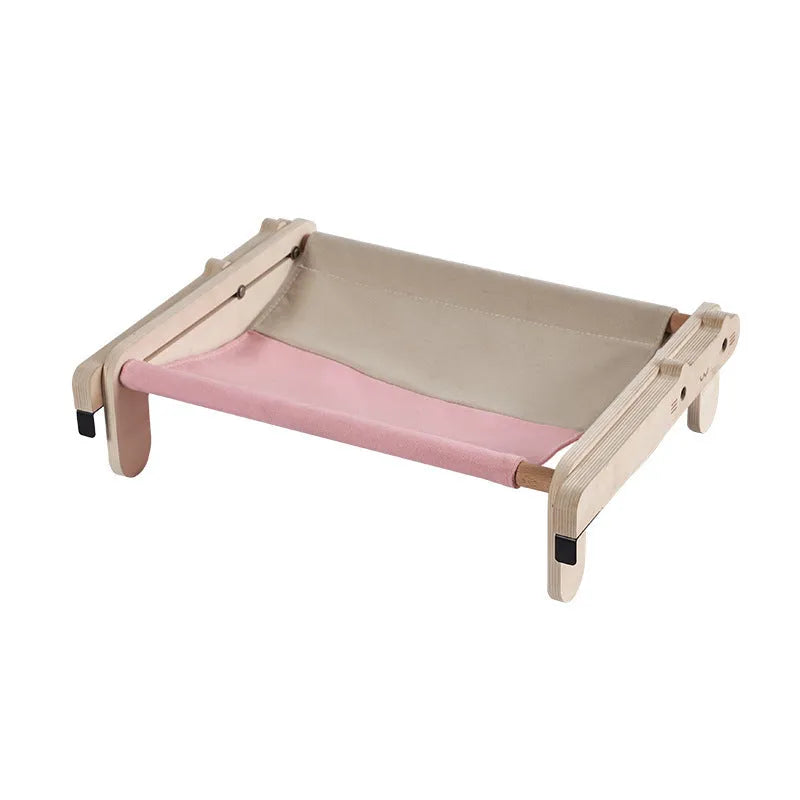 Solid wood cat bed with removable fabric in black and white plaid pattern