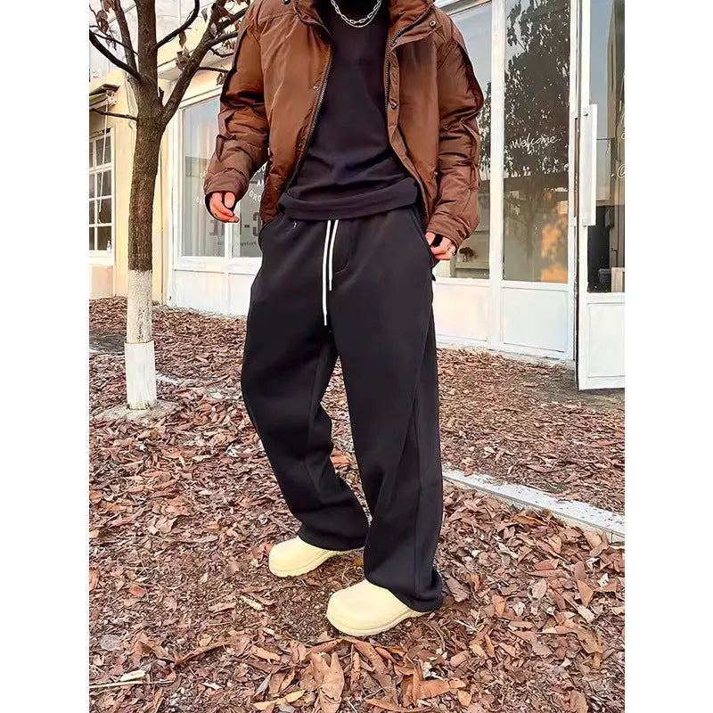 Men's casual sweatpants in black cotton loose fit with elastic waist and mid rise side view