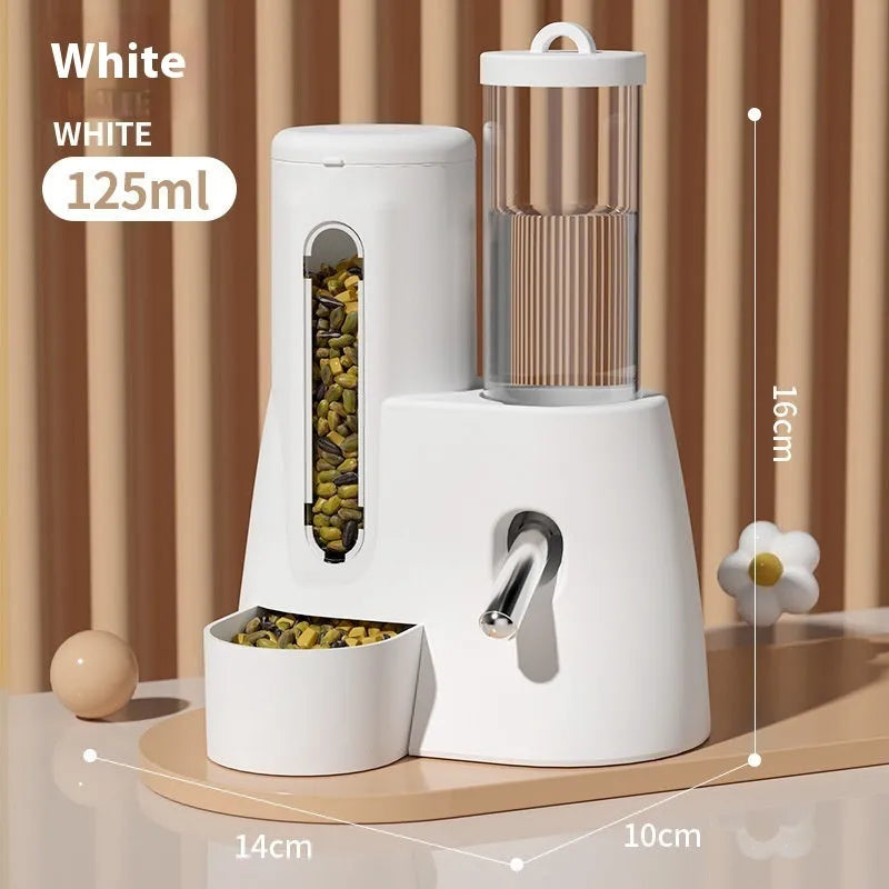 A white, blue, or pink plastic automatic water feeder and food basin for Djungarian hamsters.