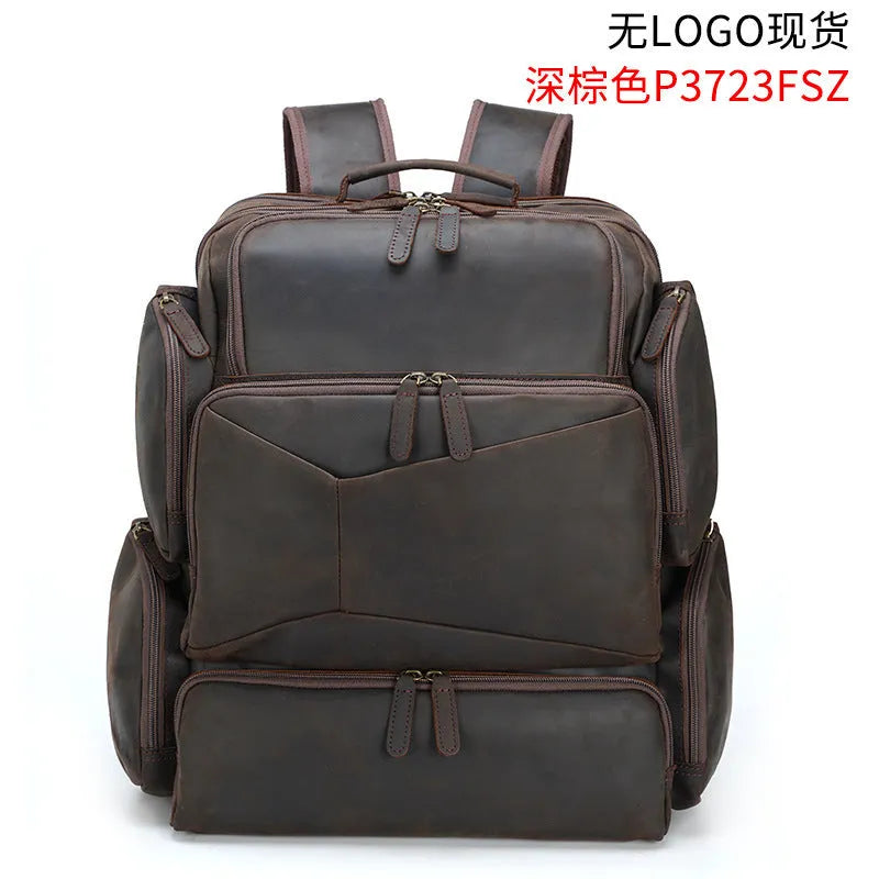 Dark brown genuine crazy horse leather backpack for men showing open pockets and organised internal compartments for a 17-inch laptop.