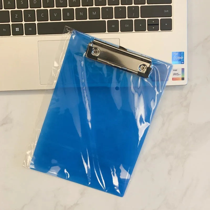 Transparent A4 writing board pad with metal clip holding paper, shown in blue colour option