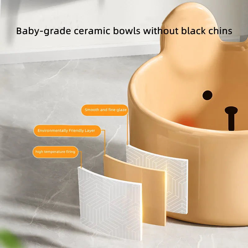 White and yellow ceramic pet bowls with rabbit and bear motifs in two sizes