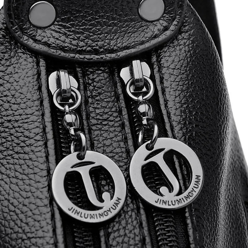 Large black women's crossbody shoulder bag with multiple internal compartments and zip closure