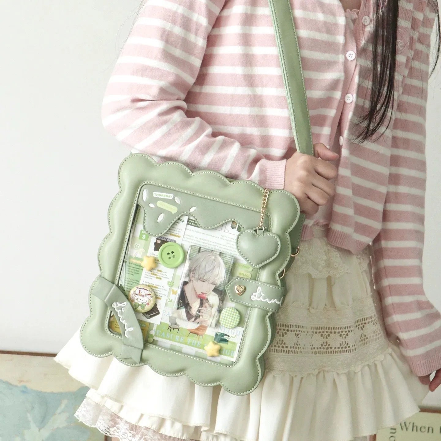 Cross-body PU bag in brown with bow detail, open pocket, and shoulder strap roll