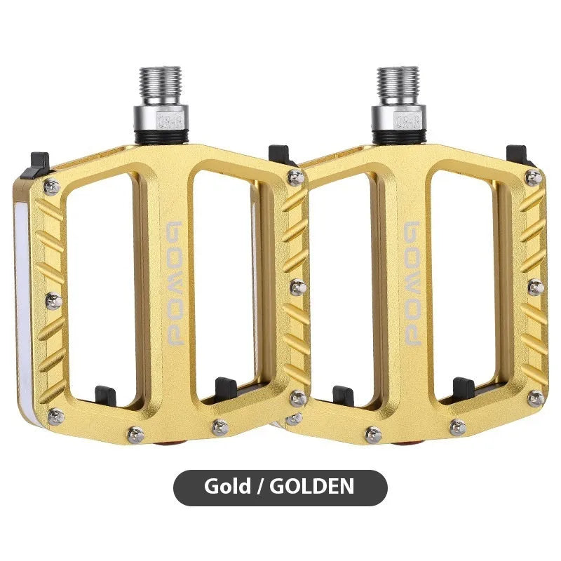 Pair of aluminium alloy bicycle pedals with integrated 710 LED lights in a choice of colours.