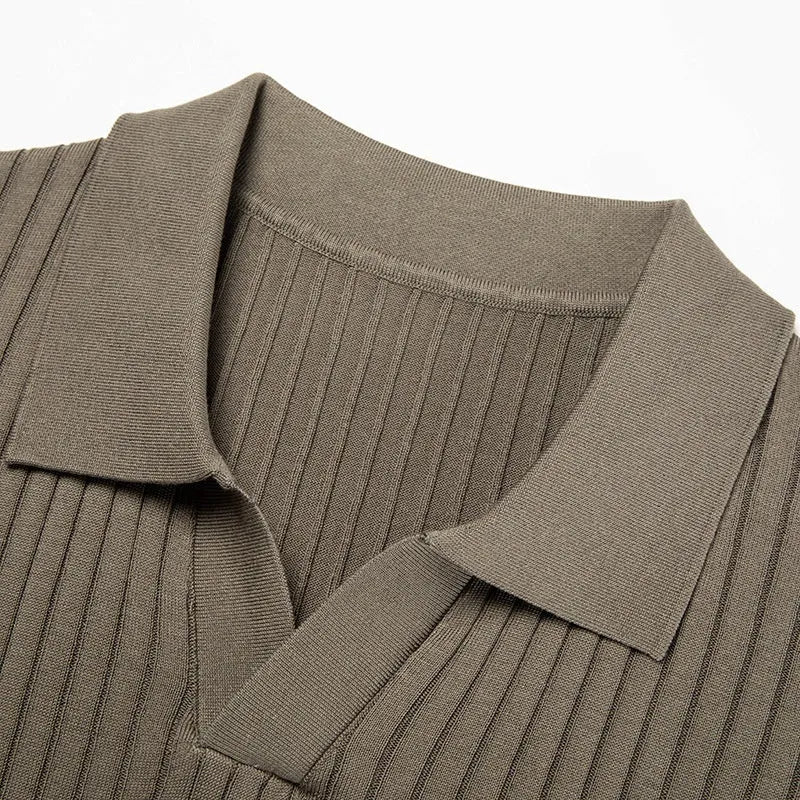 Man wearing a striped mulberry silk T-shirt with a lapel collar in a neutral colour.