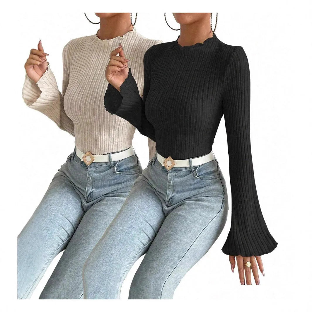 Long sleeve round neck slim fit top in black with lantern sleeves and a subtle sunken stripe pattern.