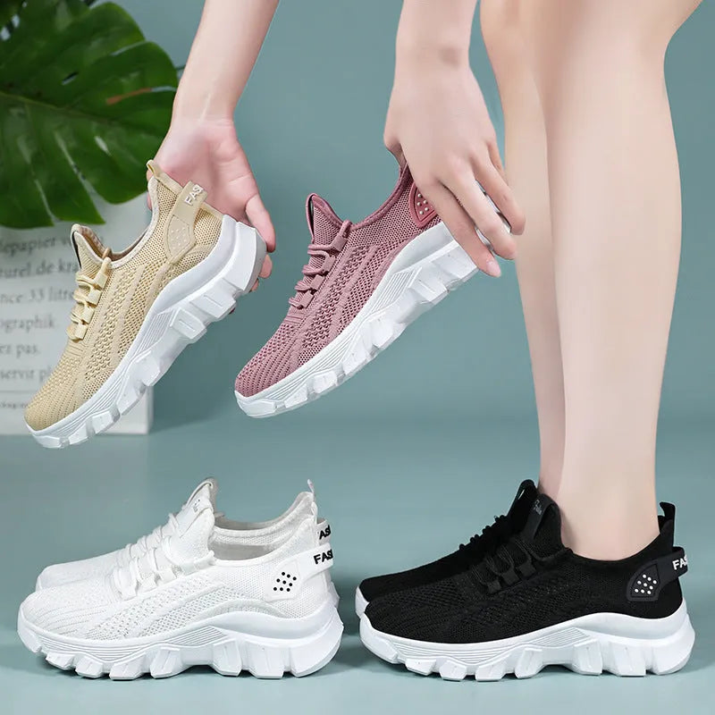 Women's Flyknit sneakers in white colour with round toe and lace-up front