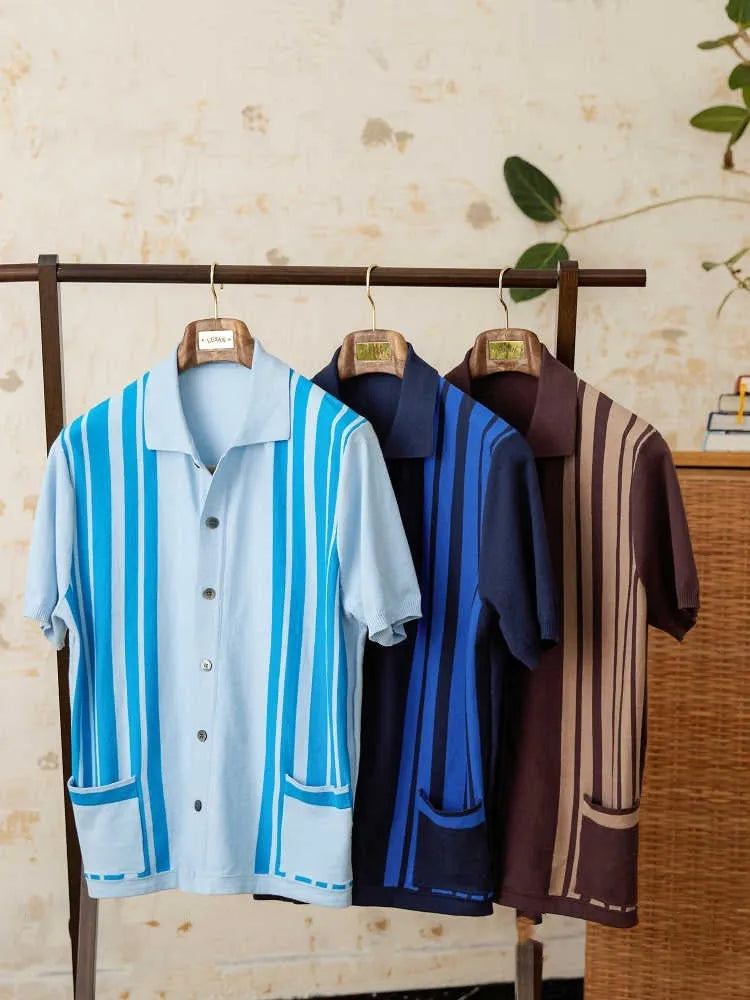Short-sleeved striped knit polo cardigan with a lapel collar in a light blue colour.