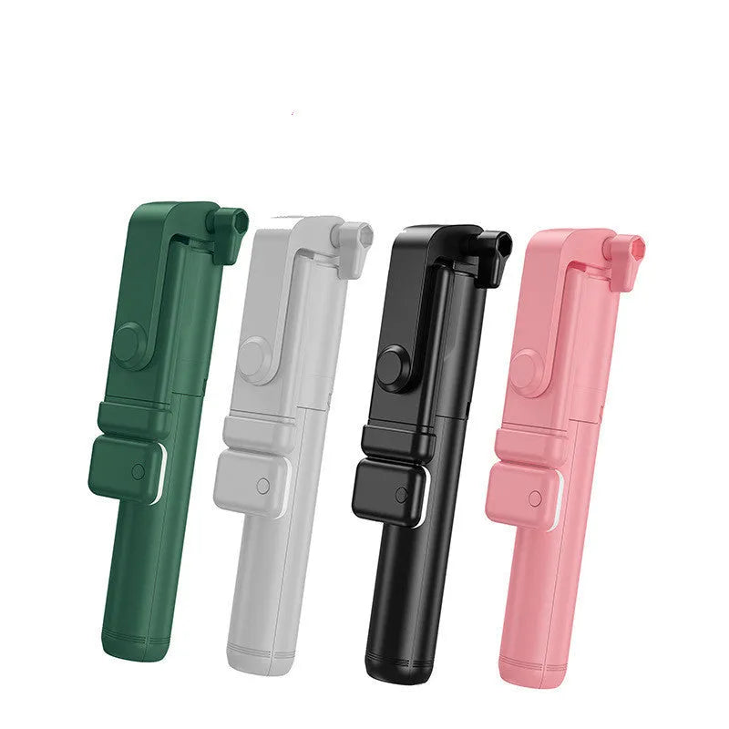 Black Bluetooth selfie stick with extended tripod legs holding an iPhone, showcasing its 360-degree rotating phone holder.