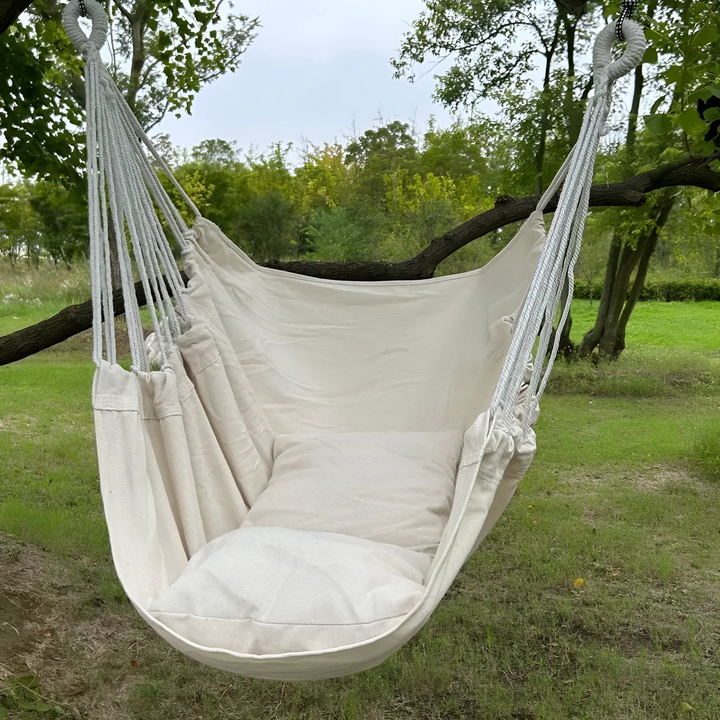 Folding canvas hammock with tassel, seat cushion, and iron pipe frame in beige
