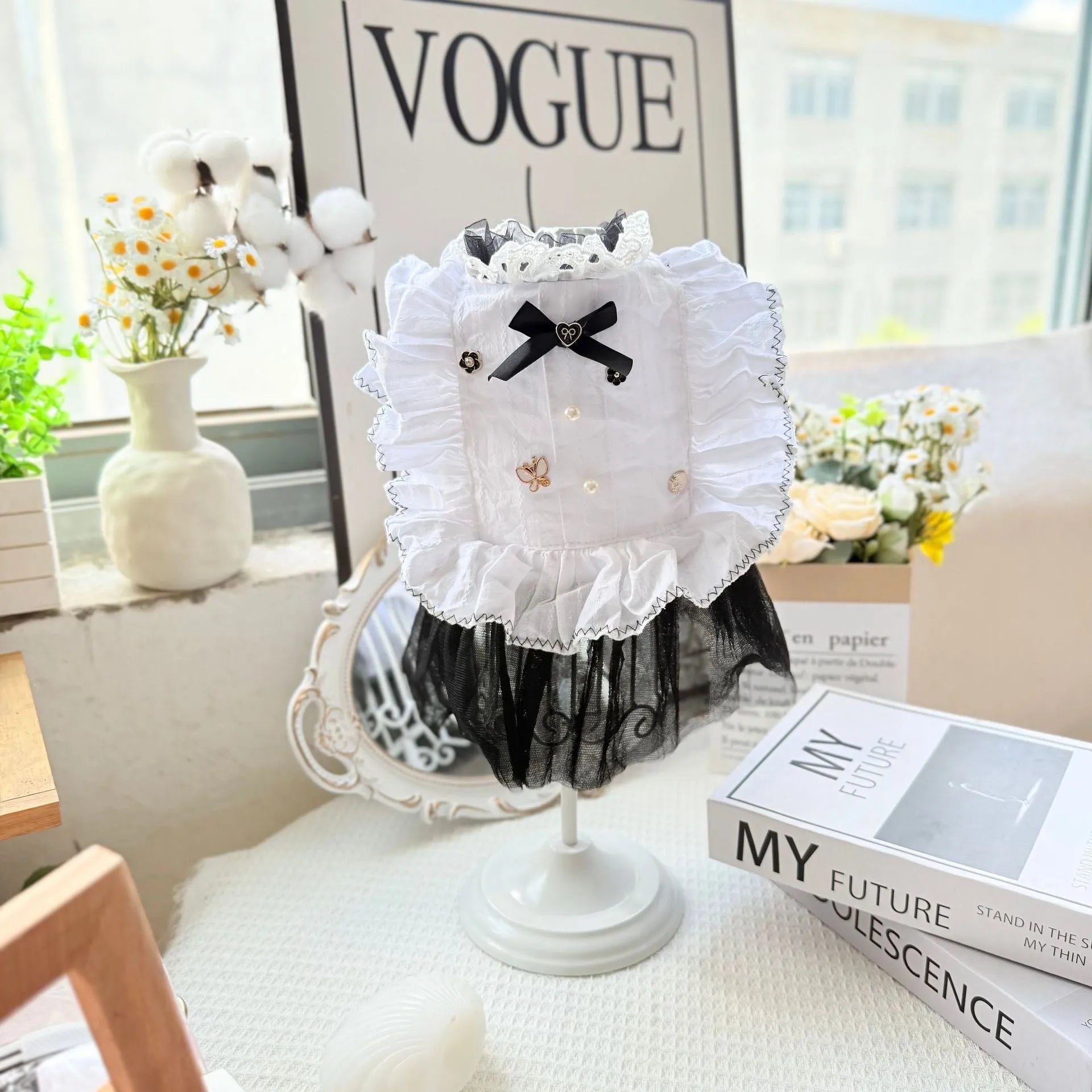 White yarn gauze skirt for small dog on a table, showing princess-style tiered design and lightweight fabric.