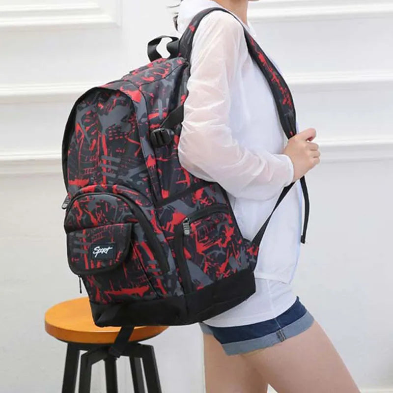 Blue classic nylon backpack with multiple pockets and adjustable padded straps, shown closed.