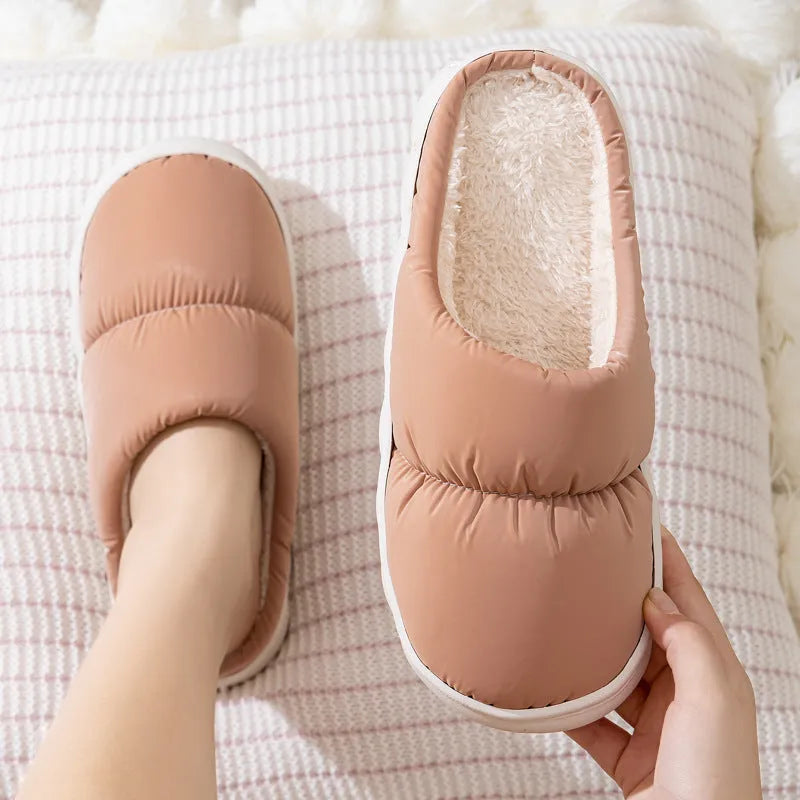 Blue down cotton winter slippers with thick rubber sole and plush lining for indoor use.